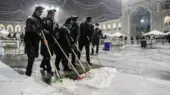 تصاویر نادر و دیدنی از برف‌روبی حرم امام رضا(ع) که قلب‌ها را گرم کرد!