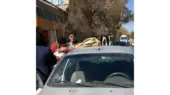 نجات از مرگ کودک 2 ساله از خودروی داغ و بدون اکسیژن / افسر پلیس اتفاقی فرشته نجات کودک شد