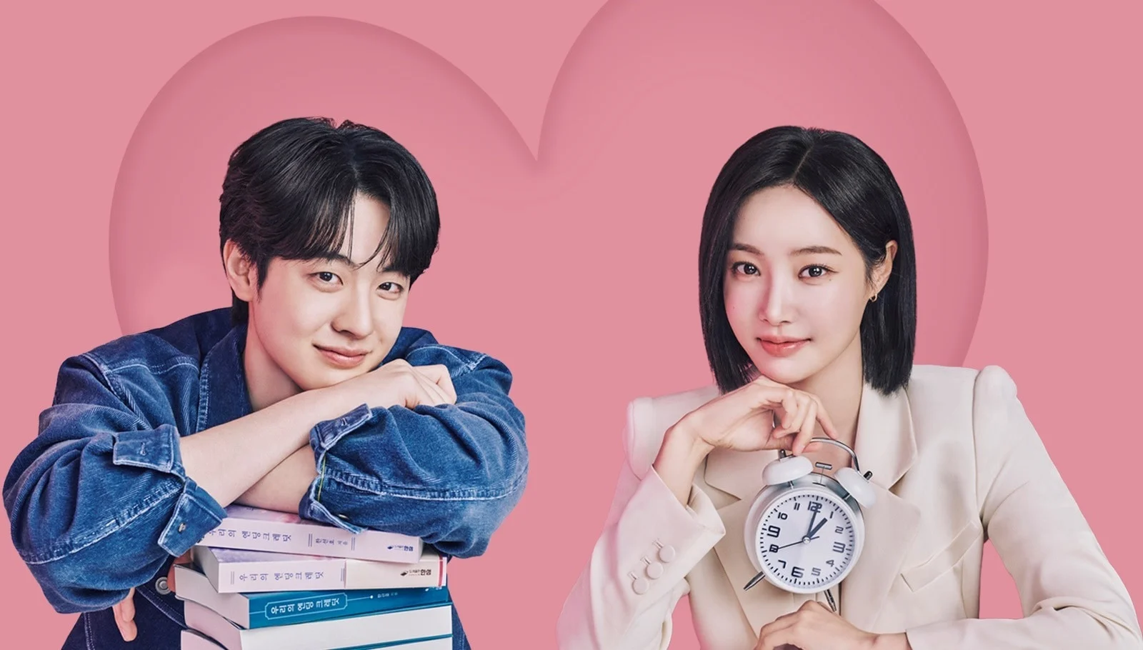 Love Phobia Kdrama Two Young Adults Pose Against a Pink Backdrop Man in a Denim Jacket with a Stack of Books and a Woman in a Light Blazer Holding an Alarm Clock