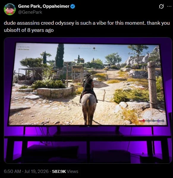 Large Flat screen Monitor Displaying a Scene from Assassin's Creed Odyssey with a Horse and Traveler in a Sunlit Village